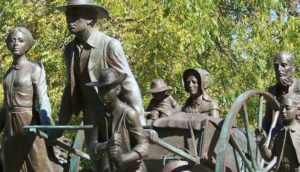 pionniers avec une charrette à bras