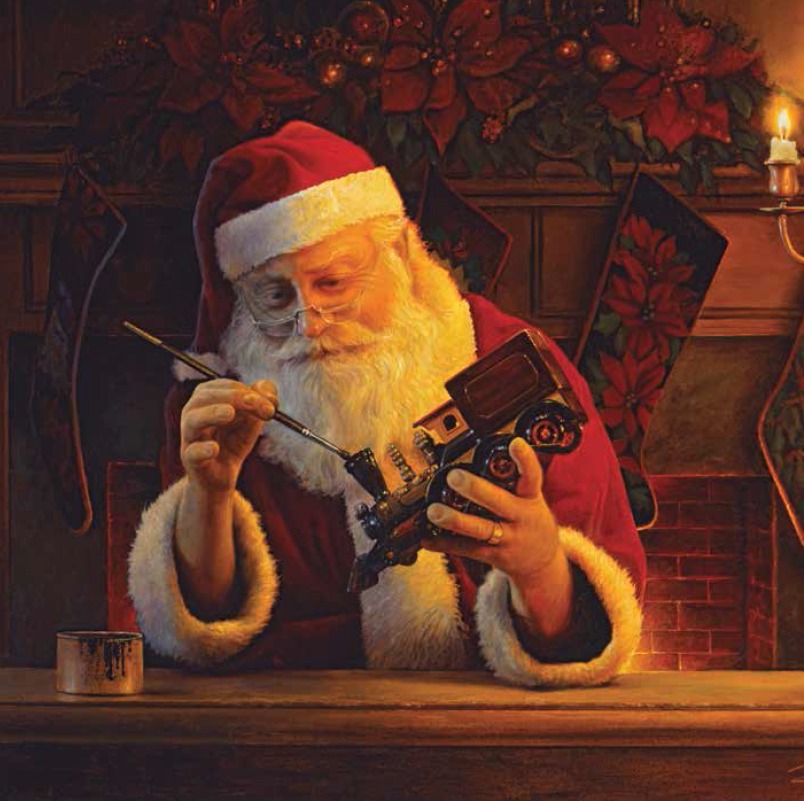 Père Noël faisant un jouet